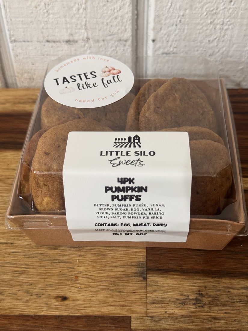 A kraft box labeled Little Silo Sweets, 4 pack Pumpkin Puffs, with a Tastes like Fall sticker